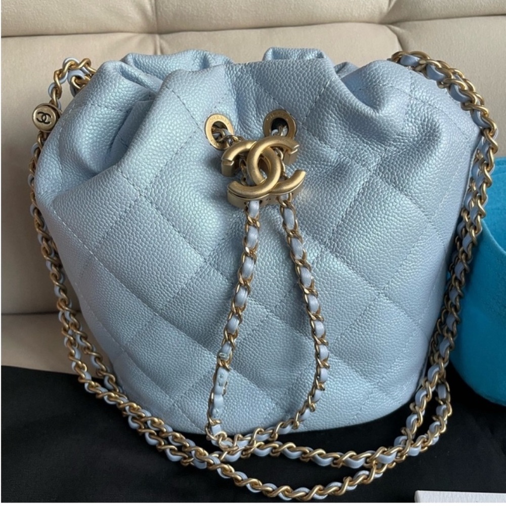 Chanel bucket bag in iridescent caviar blue with gold hardware
